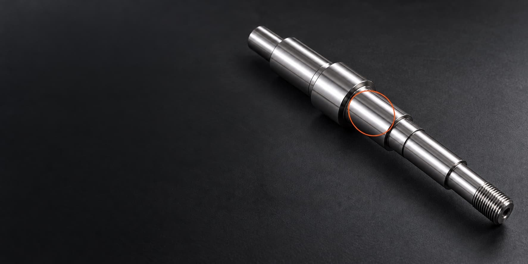 AI concept of a stepped shaft, with its bearing seat highlighted in orange